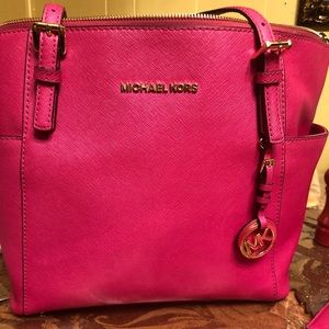 Authentic hot pink Michael kors purse with wallet.